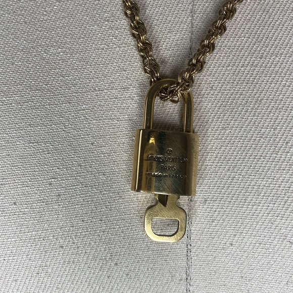 Authentic Louis Vuitton Lock & key # 312 on a Antique Gold Tone Necklace - Picture 4 of 5